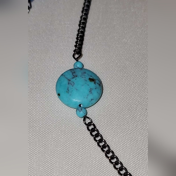 Gunmetal necklace with open shapes adorned with jasper, turquoise, and howlite. - Picture 8 of 9